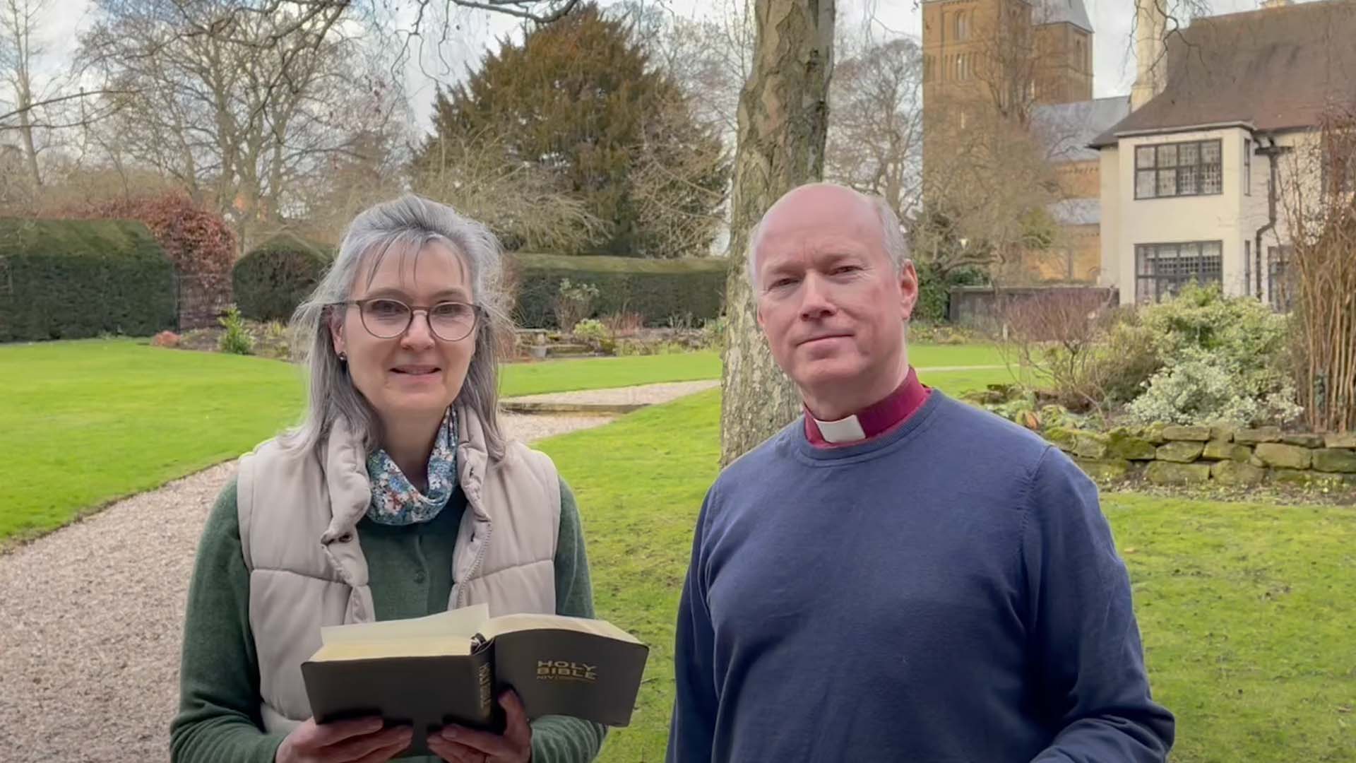 Bishop Paul and Sarah in garden with bible